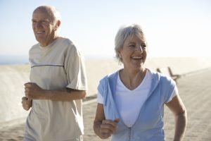 older couple jogging together outside