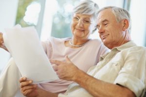 Happy senior couple planning for retirement